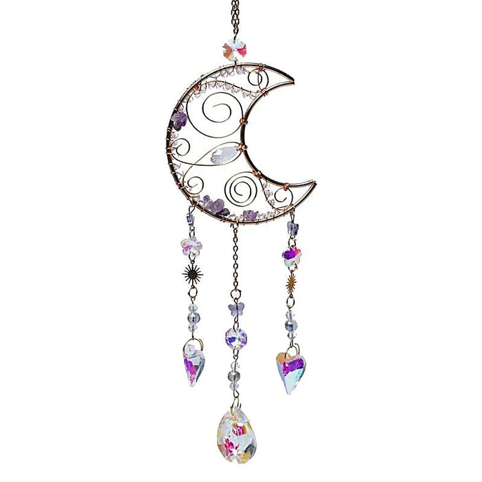 Kuu -aurinkosieppari ametistilla ja kristalleilla