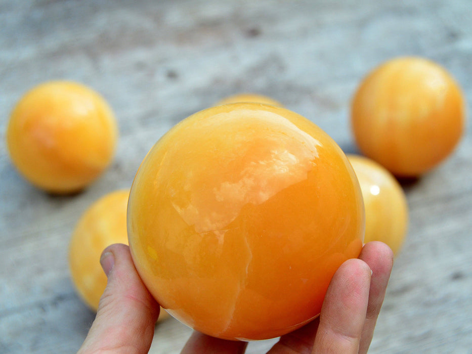 Orange calcite ball (65mm - 85mm) 