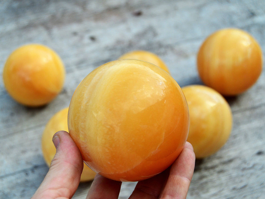 Orange calcite ball (65mm - 85mm) 