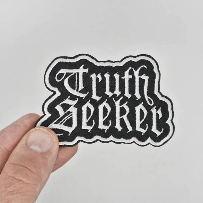 Truth Seeker valkoinen kangasmerkki